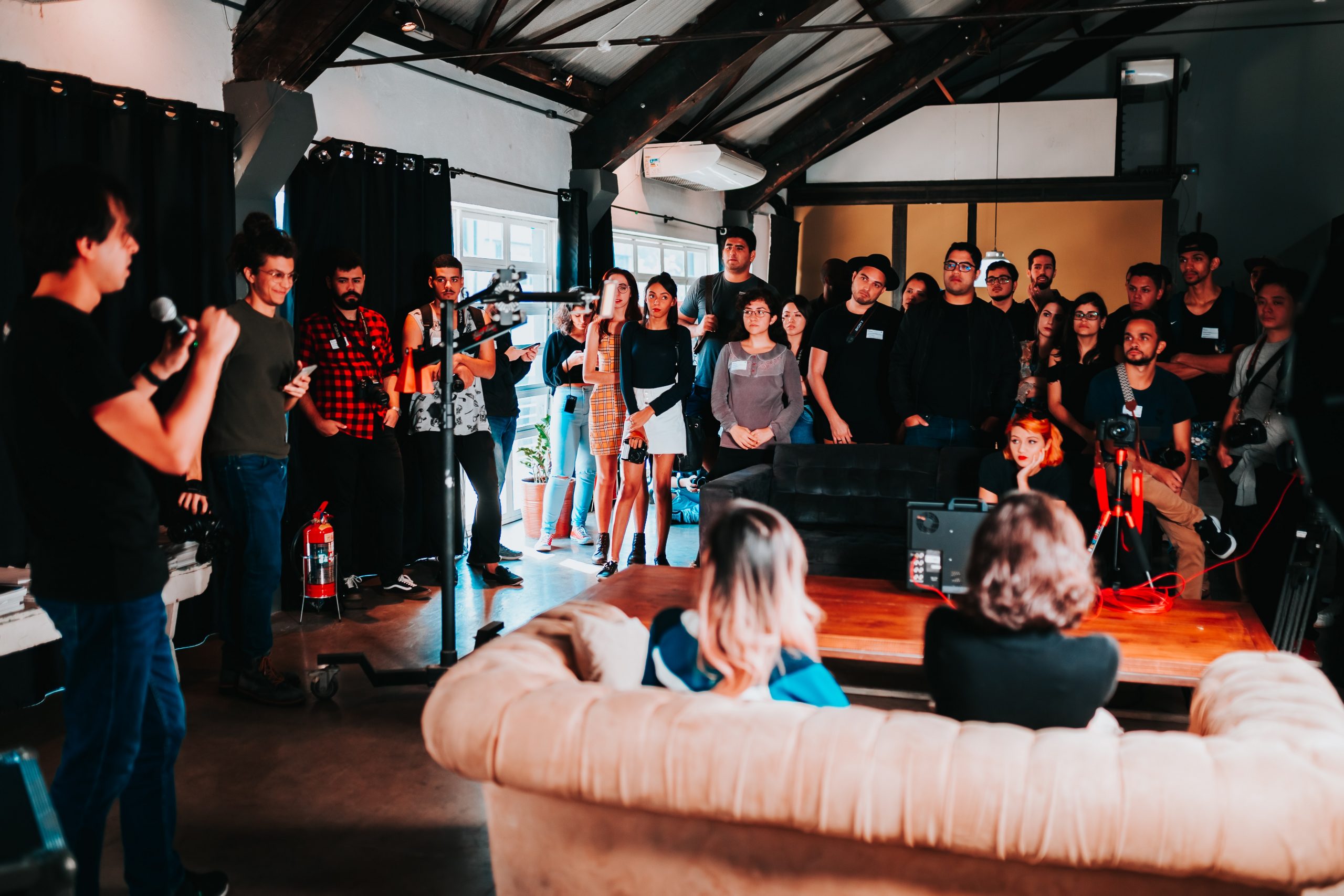 group-of-people-standing-inside-room-2608517 group-of-people-standing-inside-room-2608517